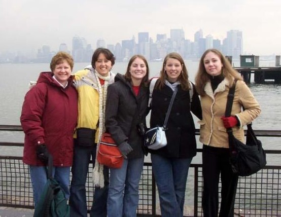 The girls, some of them at least.  L to R: Martha, Kyleigh, Jenny, Jenni, and Eryn.  This pic is on Liberty Island with NYC in the background.